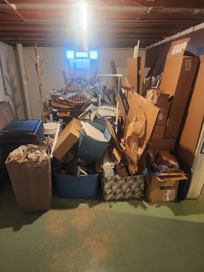 Roll-off dumpster container at job site for Yard Waste Dumpster Rental in Sturgis